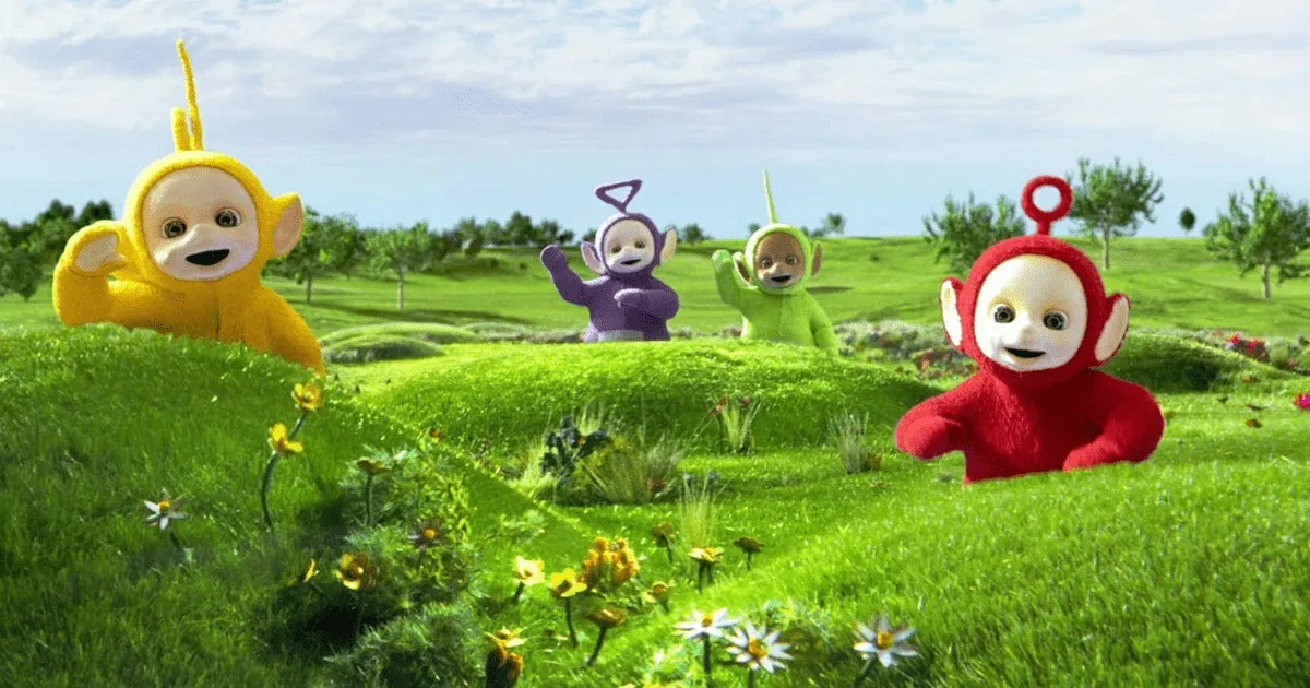 The Teletubbies pop up from their hiding spots behind small hills to say hello. They're happy to see you!